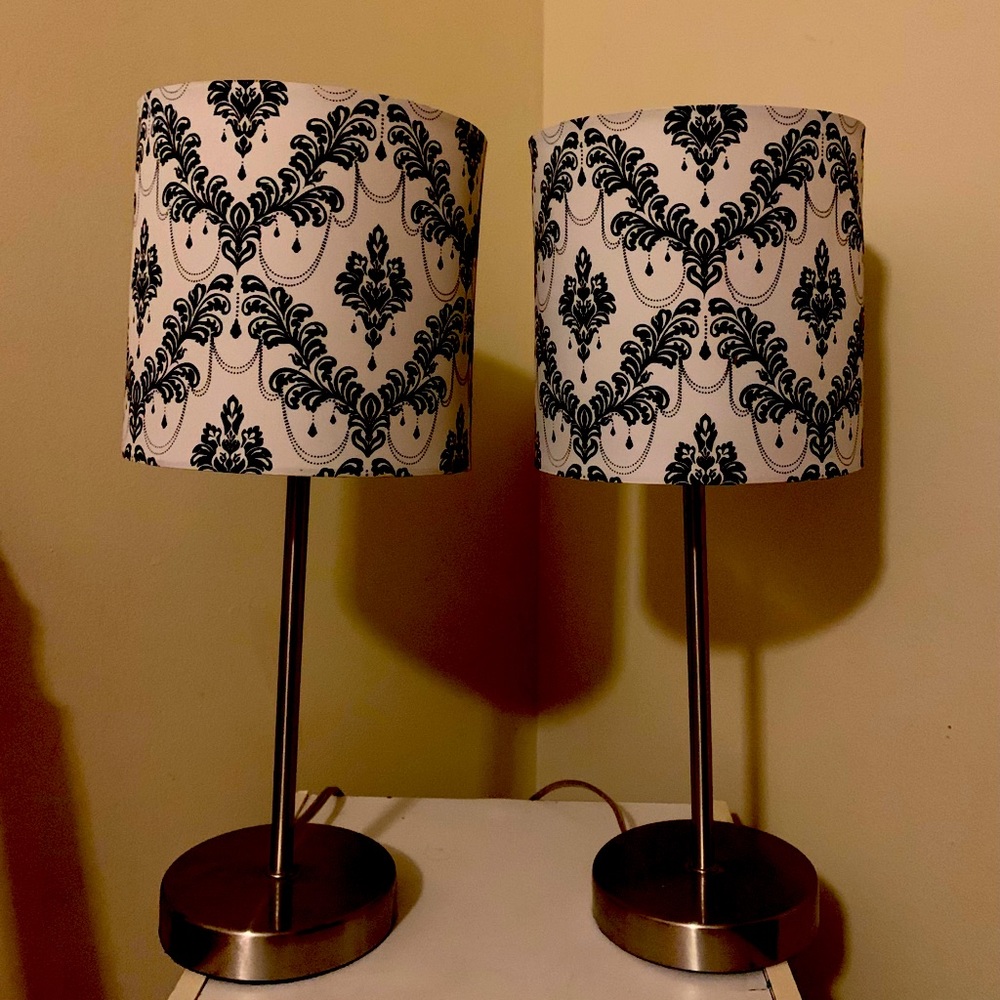 Two small white and black lamps with bedside lamps